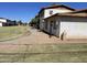 Exterior view of a multi-Gathering home with a well-maintained lawn and a concrete walkway at 7109 W Wolf St, Phoenix, AZ 85033