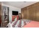 Bedroom with decorative fireplace and a large closet, with a view to an adjacent room at 730 S Country Club Dr # Ofc, Mesa, AZ 85210