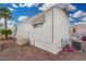This well-maintained home has a charming exterior with gravel landscaping and mature palm trees at 730 S Country Club Dr # Ofc, Mesa, AZ 85210