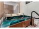 Outdoor hot tub with a privacy screen for relaxation at 730 S Country Club Dr # Ofc, Mesa, AZ 85210