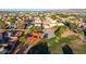 This aerial view shows a community park, a basketball court, and a playground within the surrounding neighborhood at 7319 S 56Th Dr, Laveen, AZ 85339