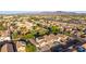 This aerial view shows the community park and the surrounding houses with a view of the distant mountains at 7319 S 56Th Dr, Laveen, AZ 85339