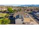 Aerial view featuring a backyard with desert landscaping, solar panels, privacy fencing, and a cozy outdoor space at 7319 S 56Th Dr, Laveen, AZ 85339