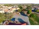 This image shows a concrete basketball court that is part of a community park near the surrounding houses at 7319 S 56Th Dr, Laveen, AZ 85339