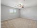 Carpeted bedroom featuring ceiling fan and window with blinds at 7319 S 56Th Dr, Laveen, AZ 85339