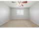 Carpeted bedroom with a ceiling fan and window with blinds at 7319 S 56Th Dr, Laveen, AZ 85339