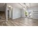 Dining room featuring wood-look floors and access to the staircase at 7319 S 56Th Dr, Laveen, AZ 85339