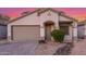 Charming single-story home with a two-car garage, desert landscaping, and neutral color palette at 7319 S 56Th Dr, Laveen, AZ 85339