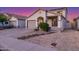 Attractive exterior of home showcasing desert landscaping, two-car garage, and inviting entrance at 7319 S 56Th Dr, Laveen, AZ 85339