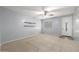 Spacious living room featuring carpet floors, a ceiling fan, and natural light at 7319 S 56Th Dr, Laveen, AZ 85339