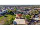 Aerial view of a park in a neighborhood, with green space, a playground, and a basketball court at 7319 S 56Th Dr, Laveen, AZ 85339