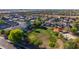 Aerial view of residential neighborhood featuring a park with open green space and playground at 7319 S 56Th Dr, Laveen, AZ 85339