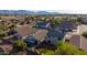 An aerial view of a beautiful neighborhood featuring well-maintained homes and desert landscaping with mountain views in the distance at 7319 S 56Th Dr, Laveen, AZ 85339