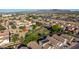 Aerial view displaying neighborhood amenities and location, showing nearby green space, shopping, and mountain views at 7319 S 56Th Dr, Laveen, AZ 85339