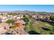 Aerial shot of community park with playground, court and green space nestled in a neighborhood with mountain views at 7319 S 56Th Dr, Laveen, AZ 85339