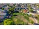 Aerial view of community park with playground and open green space surrounded by houses at 7319 S 56Th Dr, Laveen, AZ 85339