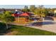The community park has a walking path around the playground, and trees offering shade for the local families at 7319 S 56Th Dr, Laveen, AZ 85339
