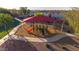 The playground at this community park has a shade structure, a small slide, and other features for climbing at 7319 S 56Th Dr, Laveen, AZ 85339