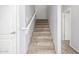Carpeted staircase leading to the upper level of the home at 7319 S 56Th Dr, Laveen, AZ 85339