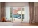 Bright bedroom featuring sliding glass doors that open up to a private pool and patio area at 7530 N Via De La Siesta --, Scottsdale, AZ 85258