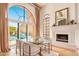 Elegant dining room with large glass windows overlooking a swimming pool at 7530 N Via De La Siesta --, Scottsdale, AZ 85258