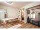 Bright room featuring wood floors, a massage table, and views to a bathroom at 7530 N Via De La Siesta --, Scottsdale, AZ 85258