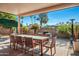 Covered patio features outdoor seating area with a table and chairs and desert landscaping at 7530 N Via De La Siesta --, Scottsdale, AZ 85258