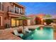 Inviting backyard pool with in-pool lounge chairs and lush landscaping at 7530 N Via De La Siesta --, Scottsdale, AZ 85258