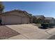 Beautiful home with a spacious three-car garage and well-manicured landscaping at 7813 E Covina St, Mesa, AZ 85207