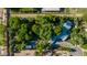 Expansive aerial view showcases the mature landscaping, swimming pool and driveway at 8302 S Jentilly Ln, Tempe, AZ 85284