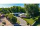 Expansive aerial view showcases the mature landscaping, driveway and curb appeal at 8302 S Jentilly Ln, Tempe, AZ 85284