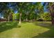 Expansive backyard featuring mature trees and lush, green ground cover at 8302 S Jentilly Ln, Tempe, AZ 85284