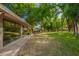 Backyard with expansive lawn, mature trees, and outdoor dining area at 8302 S Jentilly Ln, Tempe, AZ 85284