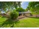 View of back yard showing a well-manicured lawn with a brick patio area at 8302 S Jentilly Ln, Tempe, AZ 85284