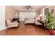 Cozy bedroom featuring hardwood floors, closet space, and ample natural light at 8302 S Jentilly Ln, Tempe, AZ 85284
