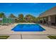 Sparkling community pool surrounded by lounge chairs, ideal for relaxation and recreation at 8302 S Jentilly Ln, Tempe, AZ 85284