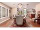 Traditional dining room with hardwood floors, natural light, and neutral wall paint at 8302 S Jentilly Ln, Tempe, AZ 85284