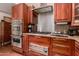 Gourmet kitchen features high-end Viking appliances, custom cabinetry and a granite countertop at 8302 S Jentilly Ln, Tempe, AZ 85284