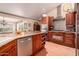 Well-equipped kitchen featuring stainless steel appliances, custom cabinetry, and granite countertops at 8302 S Jentilly Ln, Tempe, AZ 85284