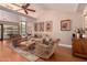Comfortable living room featuring vaulted ceilings, hardwood floors, and stylish furnishings at 8302 S Jentilly Ln, Tempe, AZ 85284