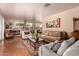 Spacious living room with hardwood floors, large windows, and comfortable seating at 8302 S Jentilly Ln, Tempe, AZ 85284