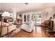 Bright living room with hardwood floors, comfortable seating, and natural light at 8302 S Jentilly Ln, Tempe, AZ 85284