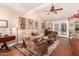 Inviting living room with vaulted ceiling, hardwood floors, and plenty of natural light at 8302 S Jentilly Ln, Tempe, AZ 85284