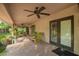 Covered patio with comfortable seating and a brick floor at 8302 S Jentilly Ln, Tempe, AZ 85284