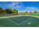 Multiple tennis courts surrounded by lush trees enhance the community's recreational options at 8302 S Jentilly Ln, Tempe, AZ 85284
