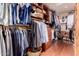 Spacious walk-in closet with custom shelving and ample storage space at 8302 S Jentilly Ln, Tempe, AZ 85284
