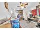 Bright, cluttered, bedroom with a ceiling fan, tile floors, and lots of storage at 919 E Villa Maria Dr, Phoenix, AZ 85022