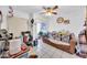 Bright, cluttered, bedroom with a ceiling fan, tile floors, and lots of storage at 919 E Villa Maria Dr, Phoenix, AZ 85022