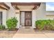 Close up of front entrance with decorative door and well-maintained landscaping at 919 E Villa Maria Dr, Phoenix, AZ 85022