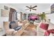 Spacious living room featuring a TV, large windows, and modern decor at 919 E Villa Maria Dr, Phoenix, AZ 85022